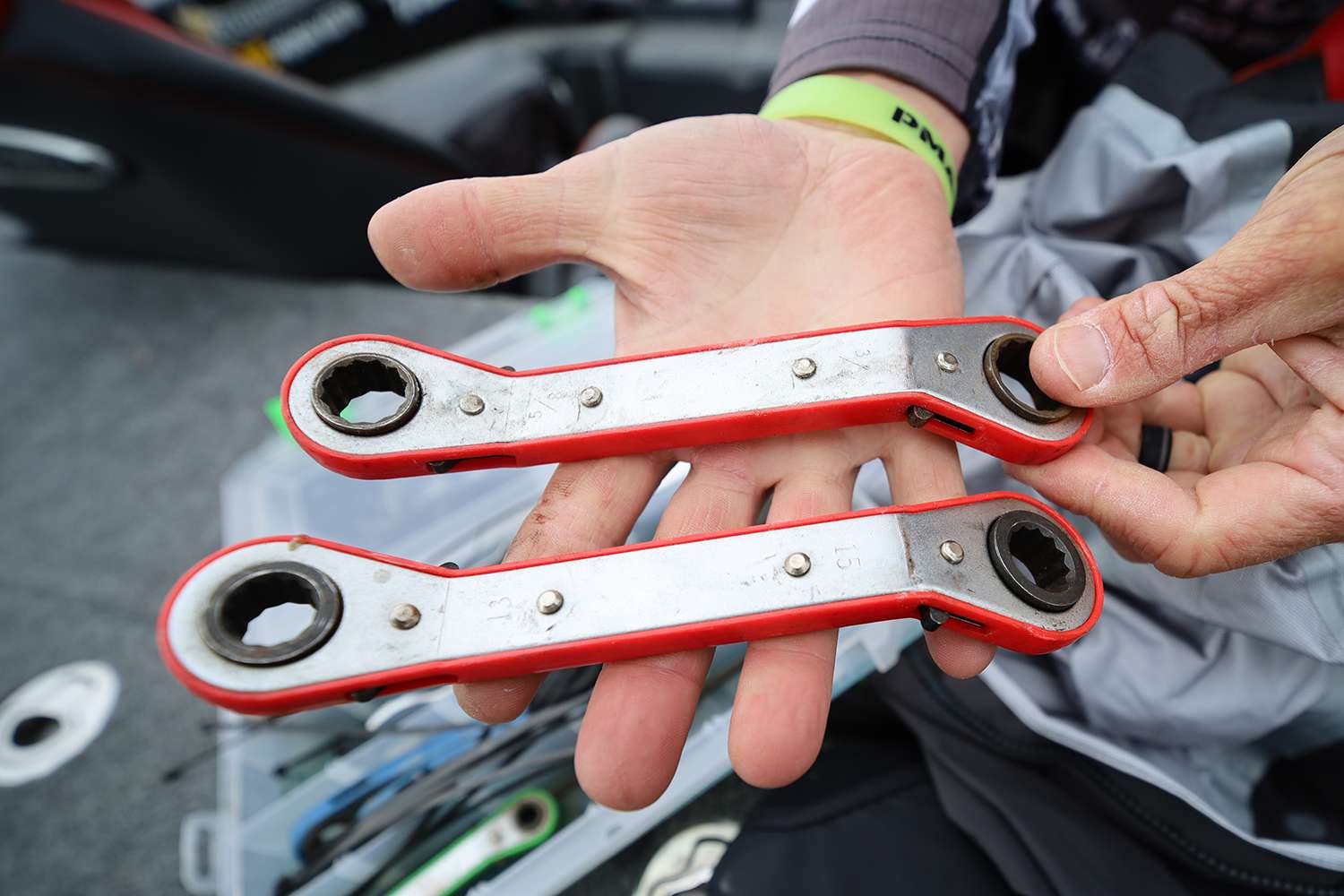 He likes tools that double up, each of these ratcheting wrenches covers two separate sizes, meaning he has four wrenches in his hand. It's all about the space.