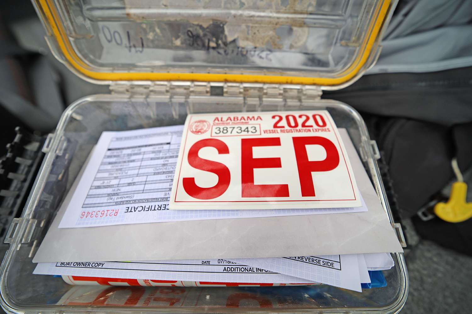 He keeps his required boater registration and other documentation in a waterproof box.
