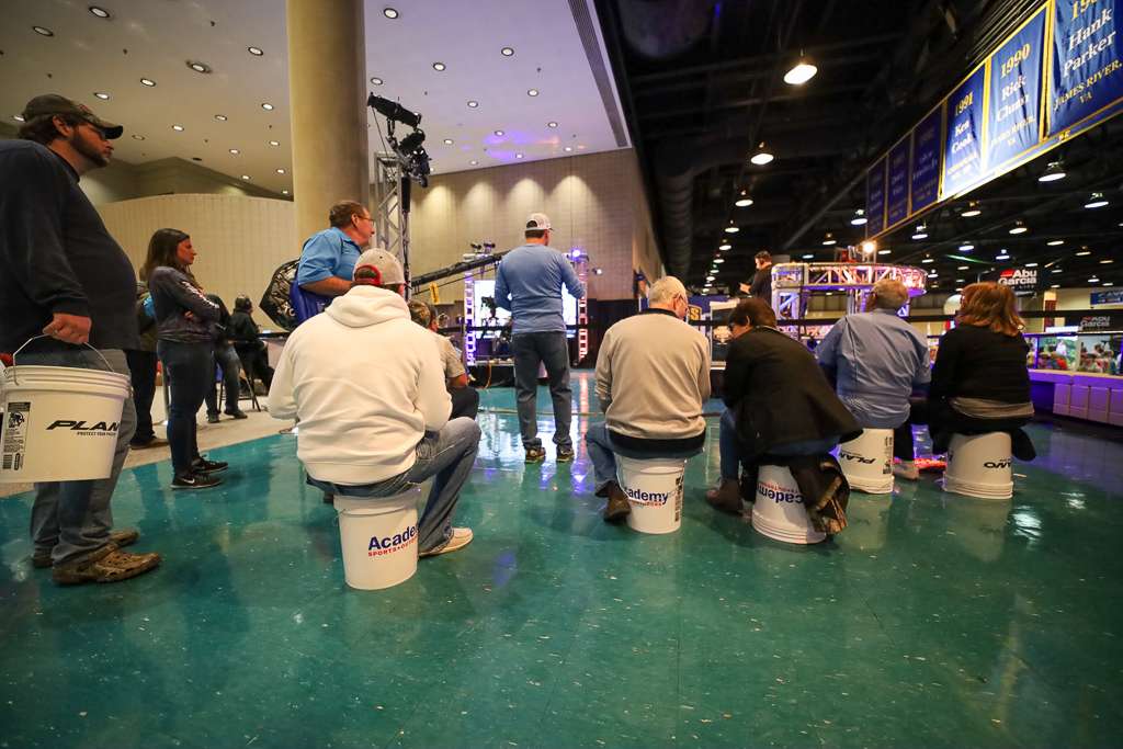Fans found a use for the thousands of buckets given out as they entered- taking a rest and watching some Bassmaster LIVE. 