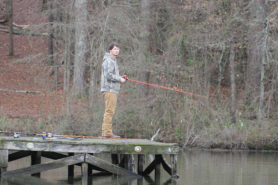A young angler fished off a nearby dock for a few minutes.