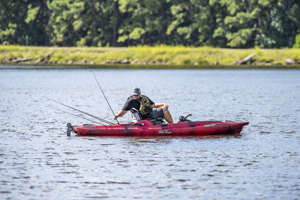 The stable design of the kayak keeps Keith Combs safe, even when he turns to reach for gear behind the seat.
