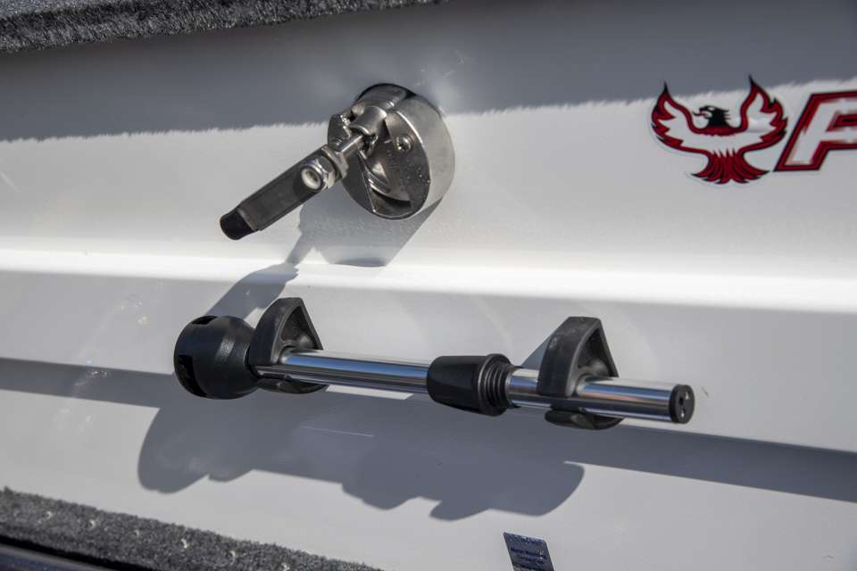 The lid of this rod locker also stores an extra running light that can be placed on the front of the boat if his built-in lights go out.
