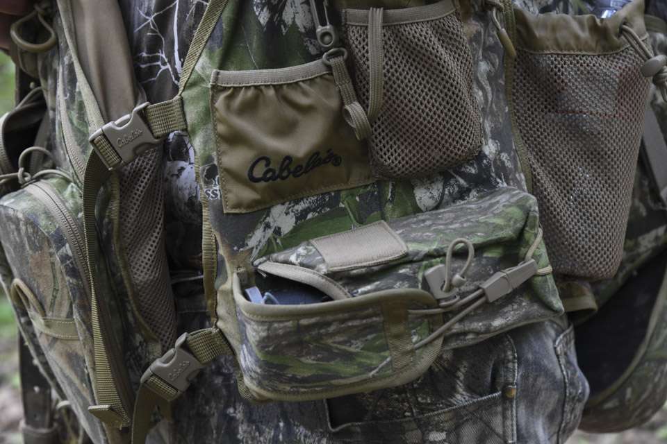 There are all kinds of tools needed in the turkey hunting game, so his vest includes numerous pockets.