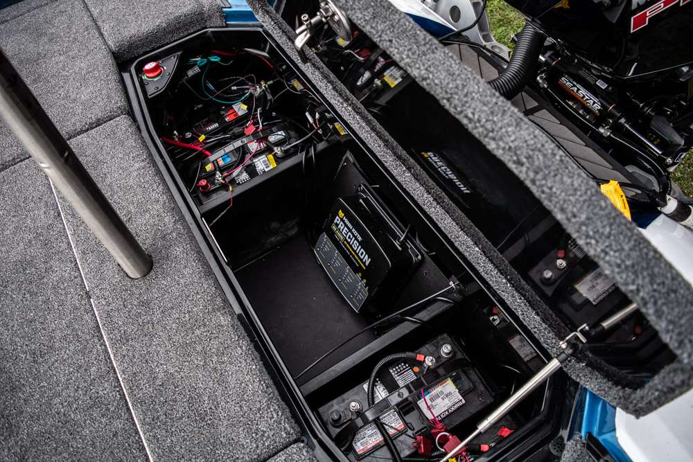 The large back compartment is filled with batteries, wires and the battery charging system. The center of the back compartment is sectioned off and organized to fit more items, if needed. 