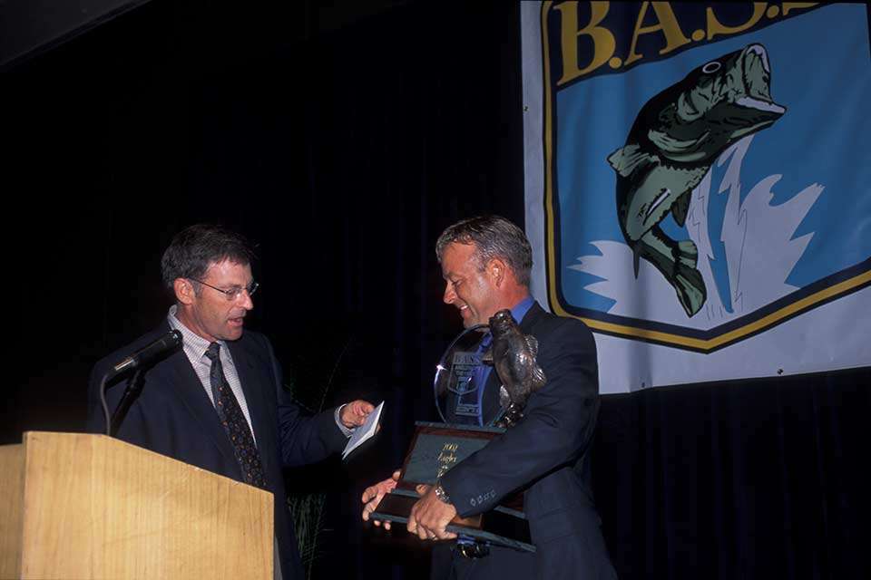 Davy Hite, who won the Alabama Invitational on Eufaula in 1994, finished third in the 2002 season-ending event there to pull away and secure his second Bassmaster Angler of the Year title. Here, Bassmaster TV host Tommy Sanders hands over the trophy to his cohort. There was a tight race going into the event, with five anglers separated by 24 points and 11 mathematically alive. Denny Brauer scored his first of two wins on Eufaula that year.