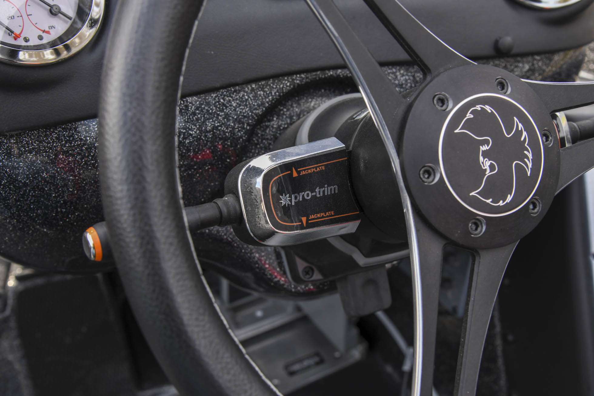  A Pro-trim switch on the left side of the steering column operates Mullinsâ T-H Marine Atlas jack plate.