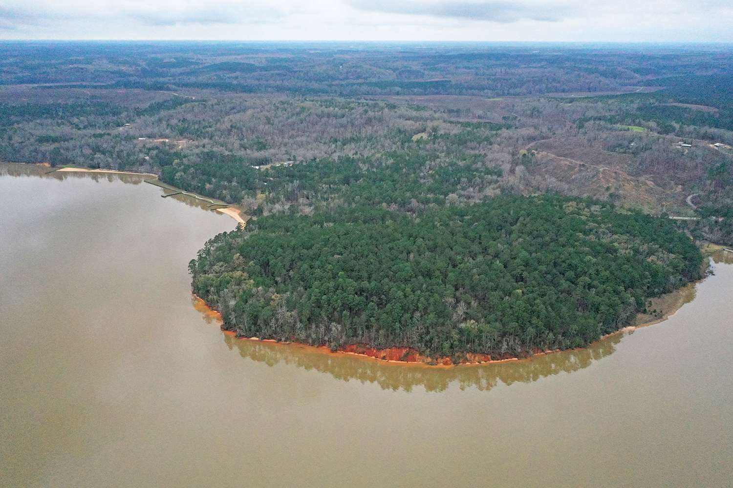 Big points with scattered stumps, brush and rocks will play a role at this event. But the classic red clay banks make obvious the location of this big southern reservoir. 