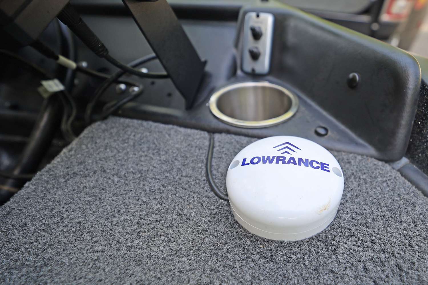 The Lowrance GPS puck is positioned near the other Lowrance equipment for precise GPS locations.