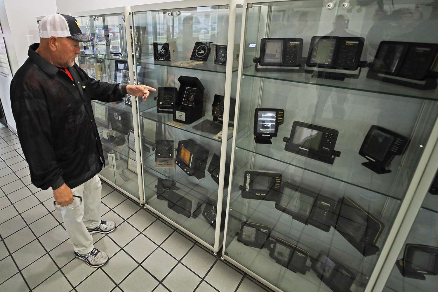 A large display case full of Humminbird history makes Herren pause for a moment. 