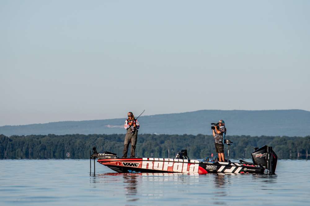 Check on Seth Feider working for the top 10 cut on Day 3 of the Bassmaster Elite at Lake Champlain sharing water with Chad Pipkens.