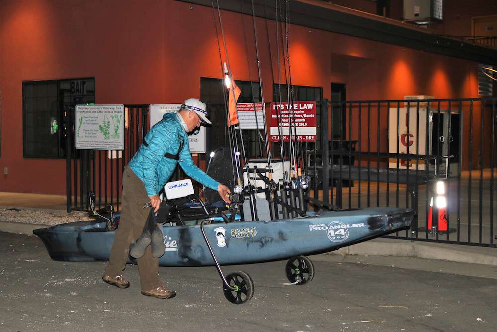 John Rush prepares his kayak for launch.