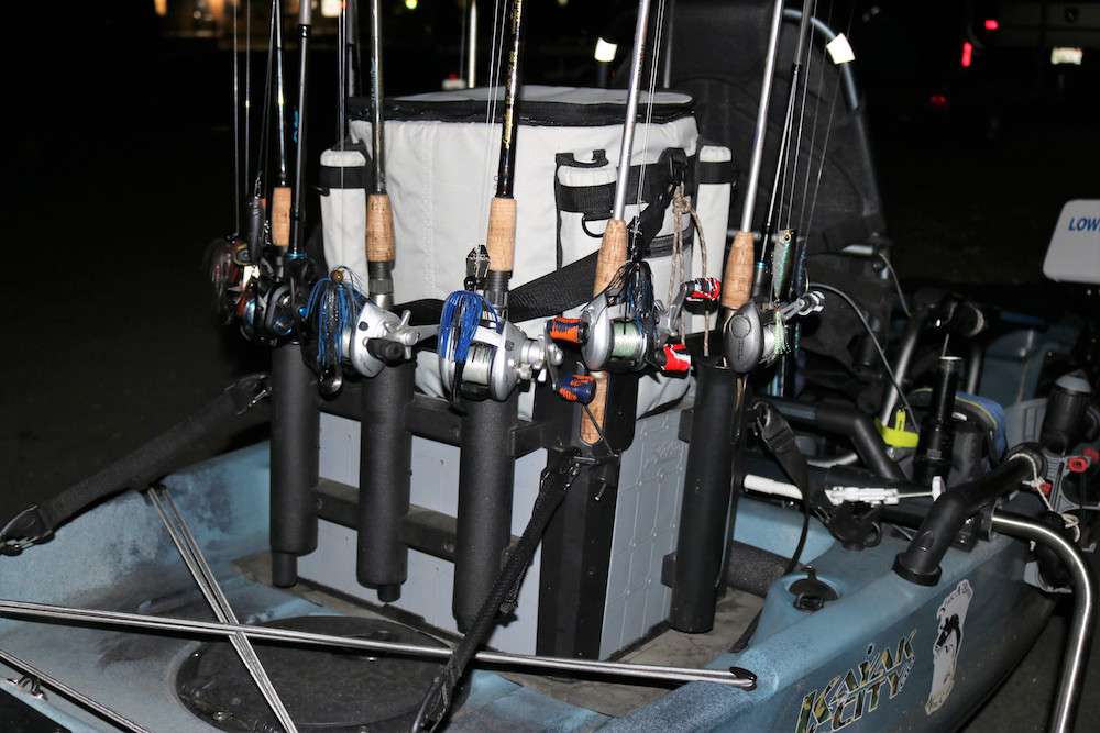 John Rush has an assortment of rods with baits to offer the Clear Lake largemouth.