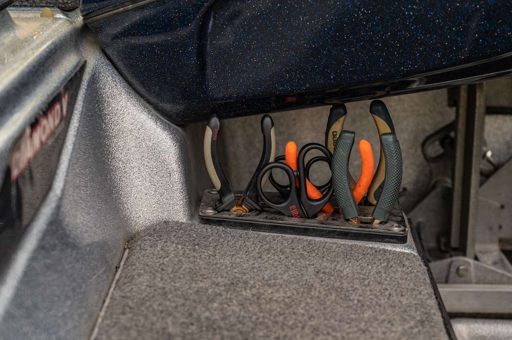 The tool holder sits just to the right of the cooler. It is tucked away where nothing gets in the way, but everything is a quick reach away when needed. Several pairs of pliers and scissors are always on hand. 