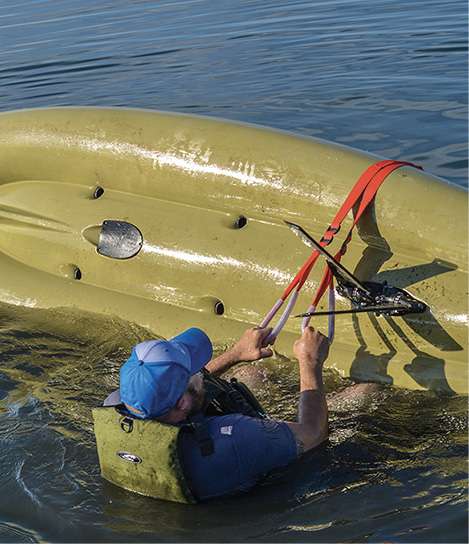 Have a stirrup strap ready to help right the kayak (we showed how to make one in a previous <a href=
