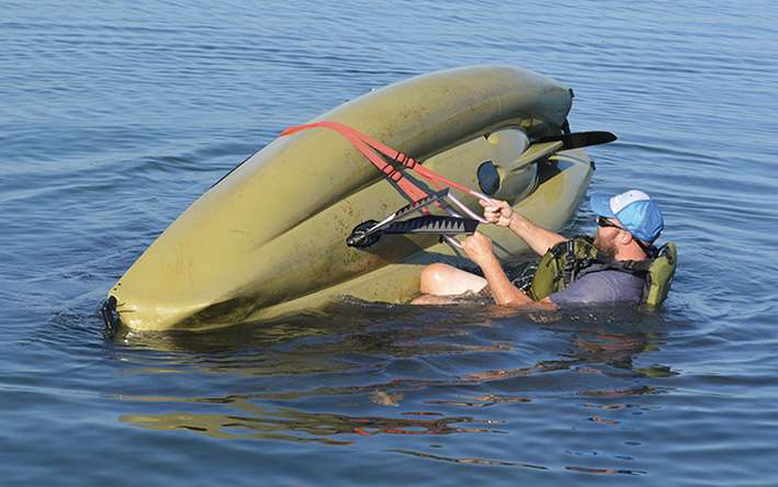 Getting back aboard a capsized kayak is fairly easy but not completely intuitive. You need to have a plan and â ideally â go out and practice. Throughout the process, keep your center of gravity low and in the middle of the kayak as much as possible. 