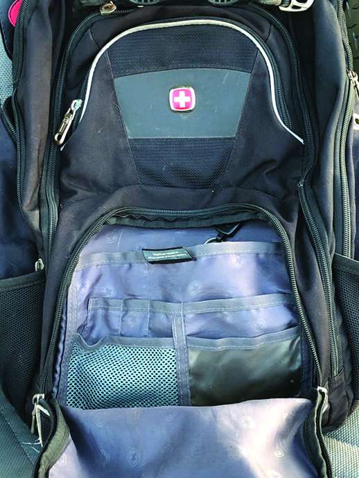 You want old backpacks and laptop bags that have sewn-in organizers for pens, business cards and cellphones. Check garage sales, resale shops and your attic. 