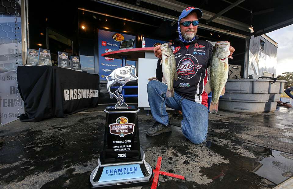 Tommy Williams poses with the trophy and the bass that landed the hardware.