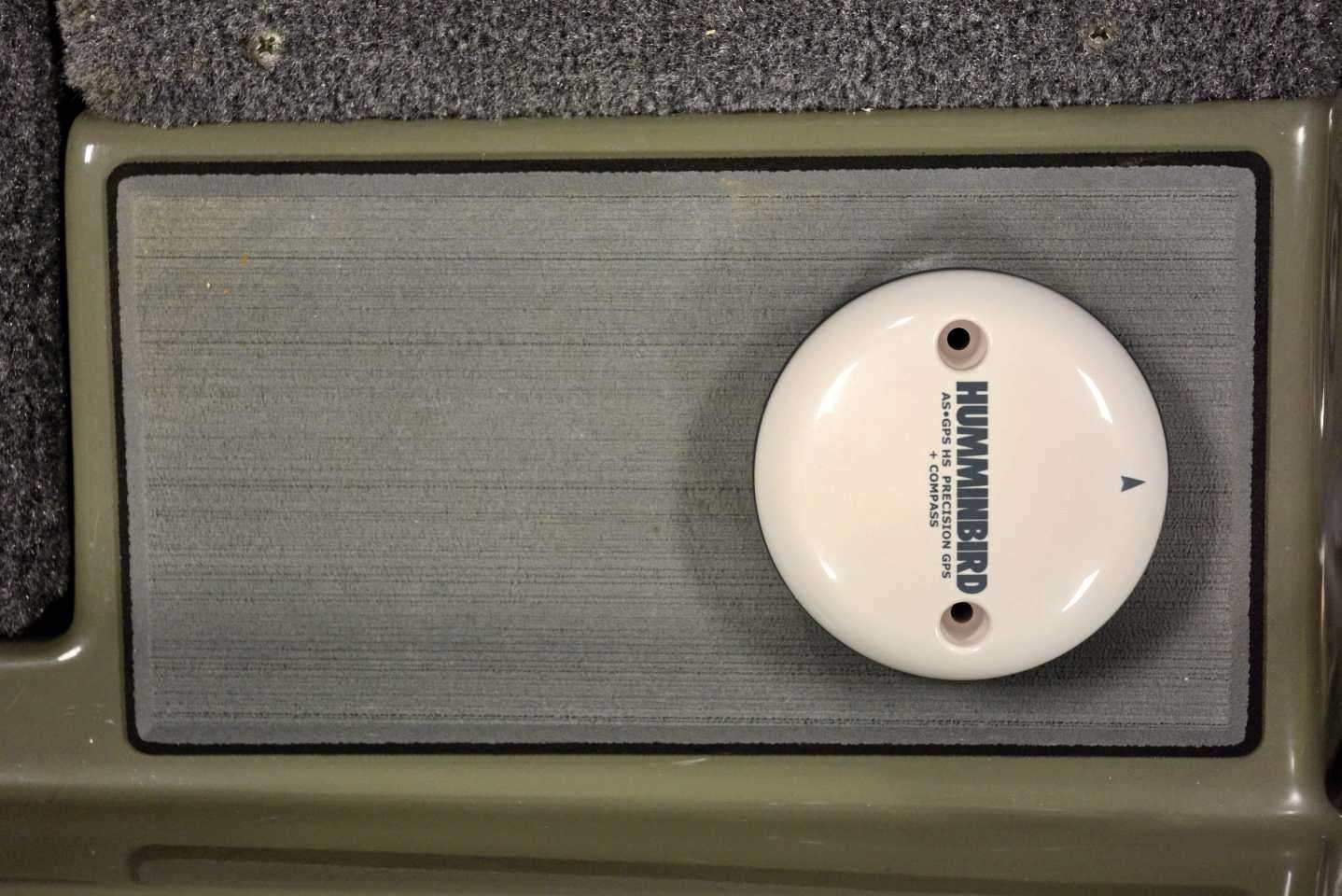 This is the Humminbird AS GPS HS External GPS Receiver. It features a built-in compass to provide true heading orientation. The ideal mounting location is nearest the transducer, which will be in the bilge. Trouble is, nearby magnets can make the compass read incorrectly, and those are used in the Minn Kota Raptor units. Falcon engineered this mounting plate directly behind the driver seat for the perfect alternative. 
