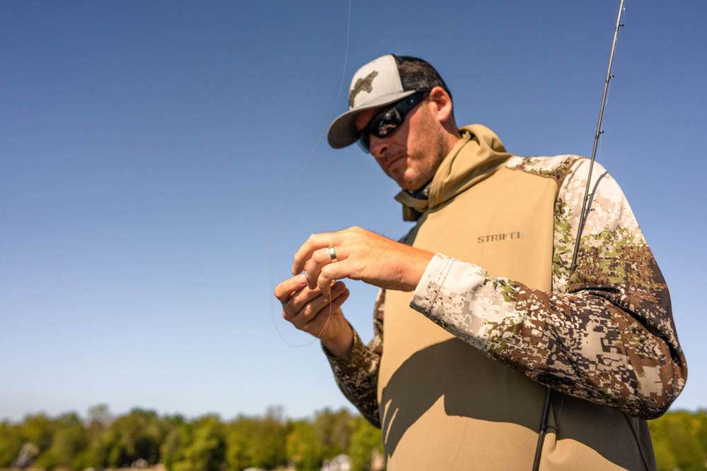A lightweight 3-panel hood adds additional sun protection for long days on the water.