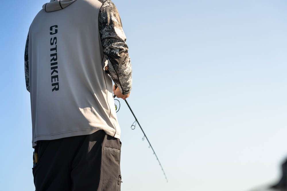 Integrated sunglass cleaning cloth at the hem provides added function anglers will appreciate.