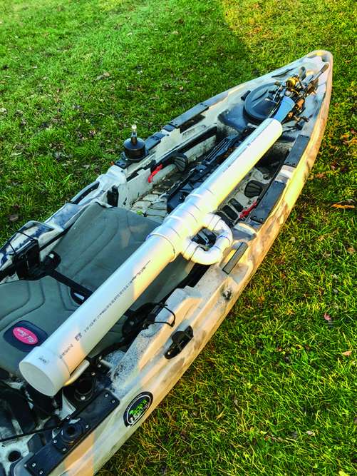 The resulting tube can accept six or seven rods in rod sleeves, reels attached. Place the tube atop your kayak, where you can secure the PVC handle to your boatâs side carry handle.
