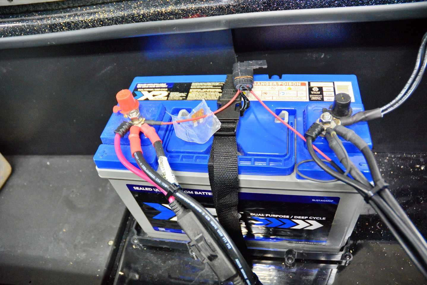 This is an X2 Power Group 31 AGM Dual Purpose, Deep Cycle 12-volt battery, featuring 1150 cold cranking amps, with capacity of 100-amp hours. Also rigged here is the custom-made Sonar Pros wiring harness, designed specifically for his boat. The harness provides dedicated power to the four units, for maximum performance.  