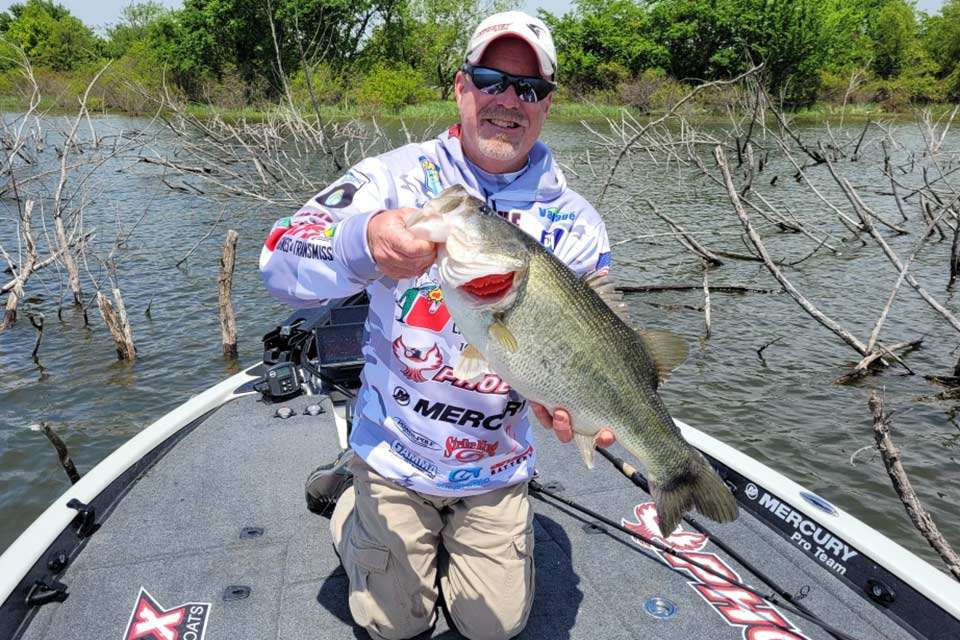 Missouri pro Chad Morgenthaler is all smiles showing his 7-13 for his judge to photograph. Along with a 6-10, Morgenthaler built a Day 1 limit of 25-15, one of eight on the day topping 25 pounds. Fork has a slot limit which helps manage the trophy fishery, and the Elite event really isnât feasible there without the catch, weigh, release format designed 15 years ago to show off Texasâ slot limit lakes like Fork. 