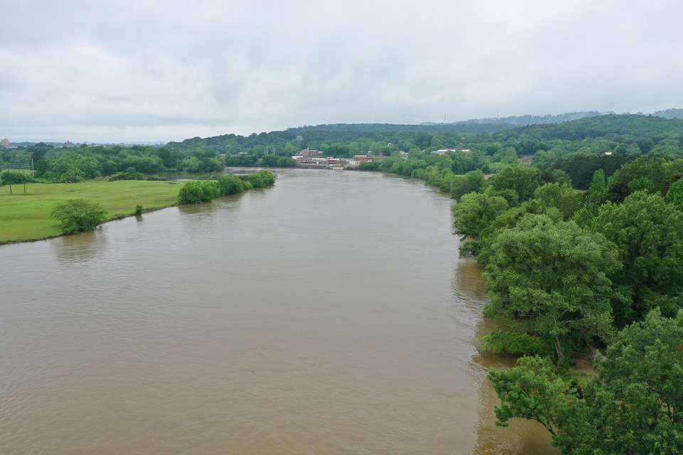 The background is the outskirts of downtown Gadsden. In the foreground is the muddy river, where we dodged quite a few floaters. Elliott said the water level had gone up at least 2 feet overnight. 
