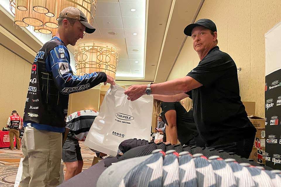 Qualifying for a Classic is the No. 1 goal of most every bass angler. The bar then moves to making the cut, reaching the Super Six and the greatest hope, winning. Besides the prestige of fishing the event, qualifying adds other perks. Brandon Card, in his fourth championship, fills up another bag of goodies in the gifting suite.