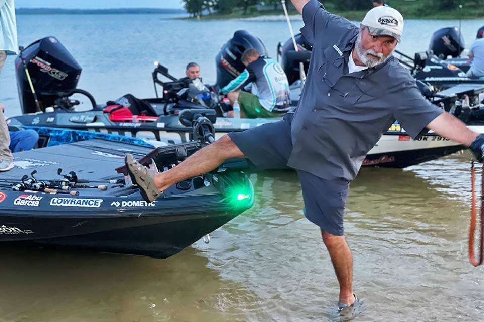 Wading out to get up close and personal with the boats several yards from the beach, photographer James Overstreet took a moment to clown for this camera. Getting serious was the next task at hand, at least for the anglers.