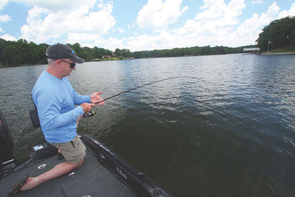 <b>1:29 p.m.</b> Loughran detects a tap on the Fuse worm, slams back his spinning rod and a big fish bolts off the hump toward open water. He races to the back of the boat, patiently works the fish closer and grabs his ninth keeper, a fine 4-pound, 4-ounce largemouth. âShe was on the same stump as that 2-8.â <br>
<b>1:43 p.m.</b> With 15 minutes remaining, Loughran drops the Fuse worm into another brushpile on the hump. He glances at the darkening sky and announces, âMy fun quota is up! Letâs head in before we get soaked.â That works for me! The bassinâ attorney has had a good day on Lake R, boating nine keepers; his five biggest fish weigh a solid 16 pounds, 12 ounces.
