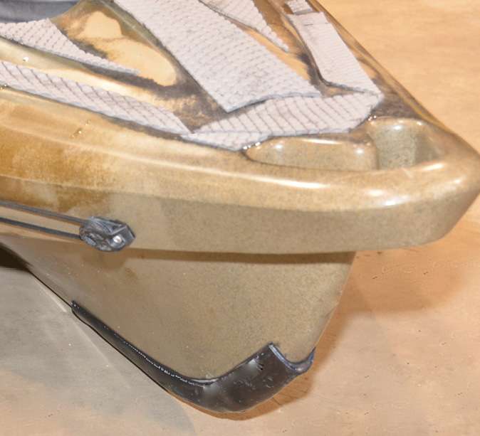 A keel guard made from plastic pipe shaped by a heat gun covers ramp rash and can be replaced after it gets scuffed. Welding gloves, a spray bottle of water and double-sided tape are other project components.
<br><br>
<em>Dave Mull</em>