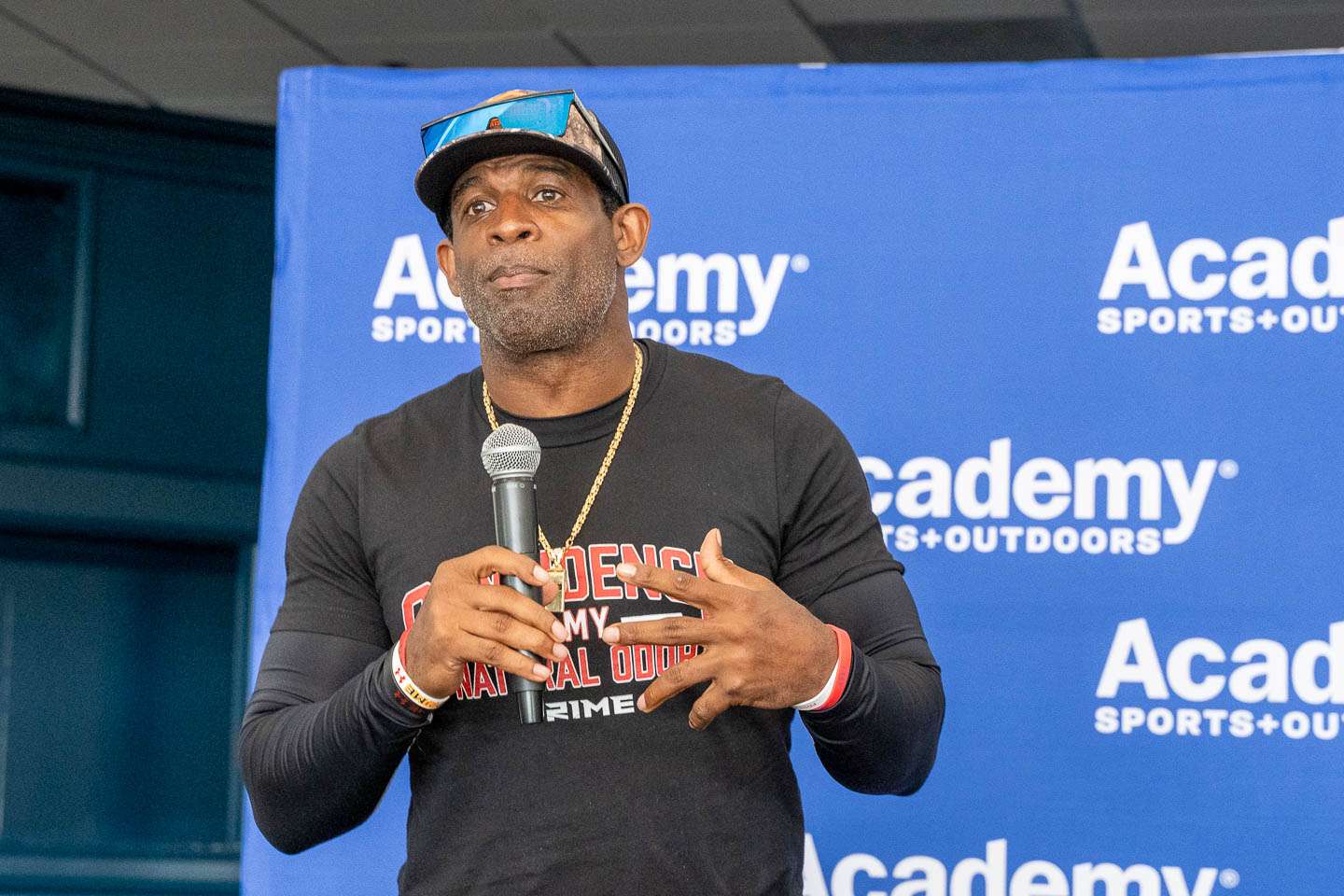 Deion spoke passionately about wanting to help young men struggling to play football and work jobs to stay in school. 