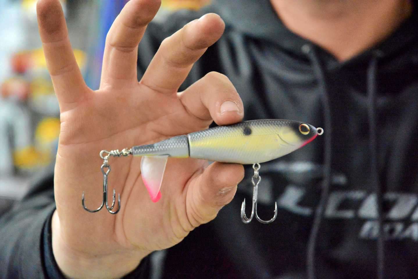 The cupped propeller tail creates an enticing plopping sound and spray that calls fish to the surface to strike. Precision weighting ensures that the tail begins spinning immediately, and it swims perfectly straight at a variety of speeds. Color of choice is MF Shad, chosen to imitate a wounded shad. 