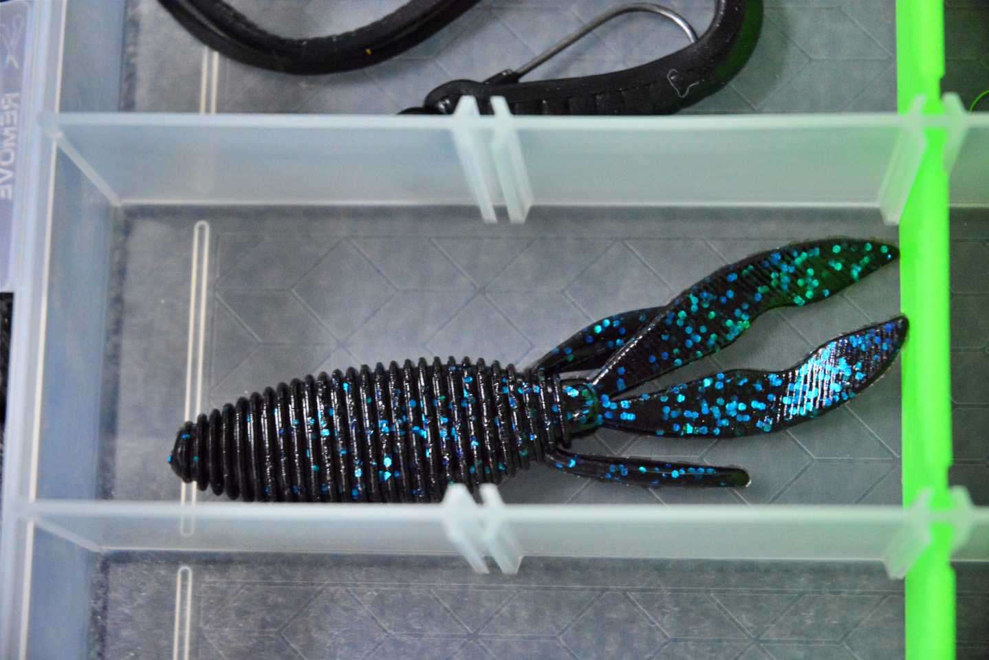 Specially cut tails generate a subtle kicking action on the fall, and a tapered body shape allows the bait to slip in and out of cover without getting tangled. A trough-style belly provides less resistance when setting the hook for better penetration. Black Blue Fleck is his color of choice. 