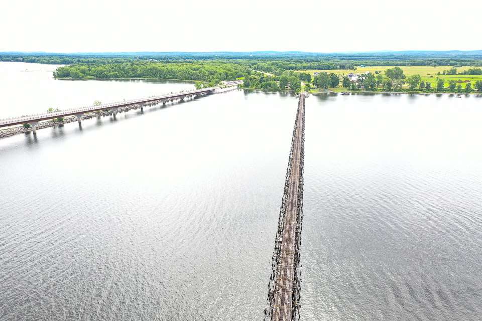 The bridge to the right is for a railroad; to the left is the highway bridge between Vermont and New York. 
