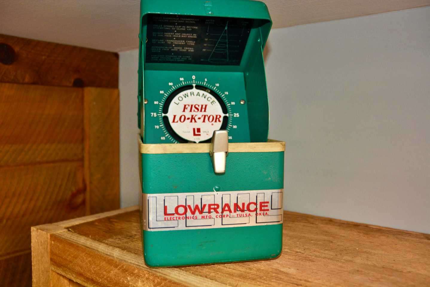 On another shelf is this vintage Lowrance Fish Lo-K-Tor, also known as the classic âGreen Box.â 