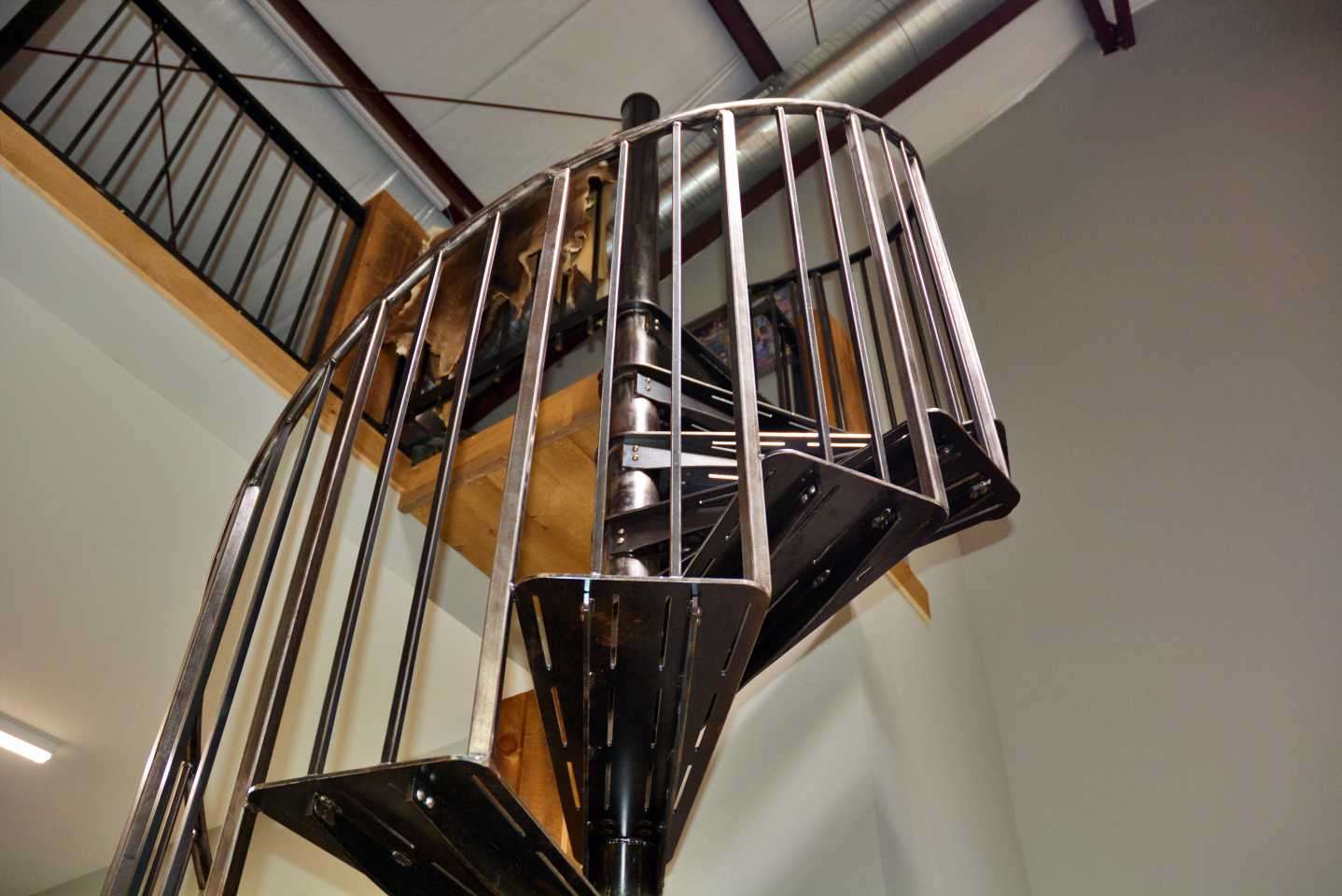 The spiral staircase was made by a childhood friend specializing in metalwork. 