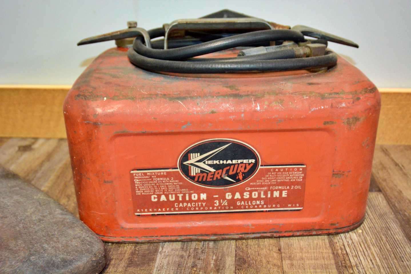 A mini-Mercury memorabilia museum is upstairs, beginning with this vintage Kiekhaefer 6-gallon fuel tank. Gross found it at an outdoor sale in Alabama. 
