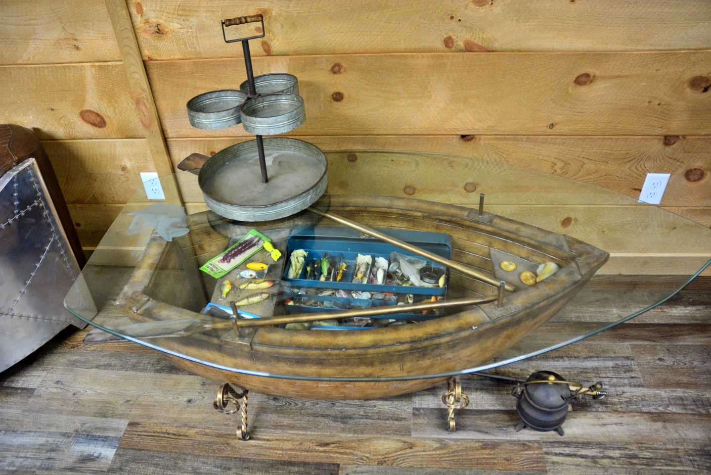 Inside the boat-hulled shaped table is a special family heirloom. The centerpiece is his grandfatherâs tacklebox, and filled with lures used by him on Lake Chickamauga and elsewhere. 
