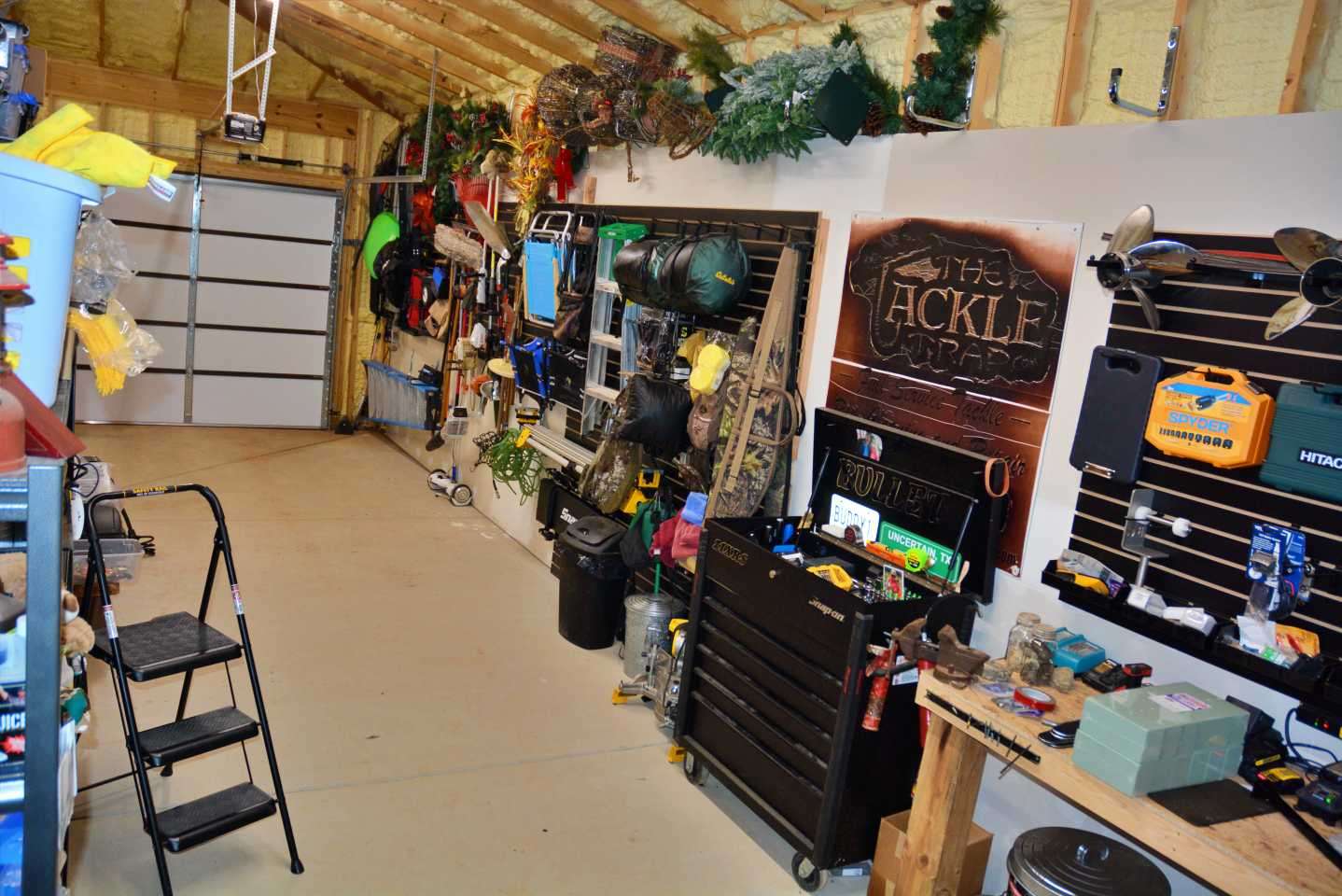 This is a separate room filled with more tackle and items youâd find inside a home garage. 