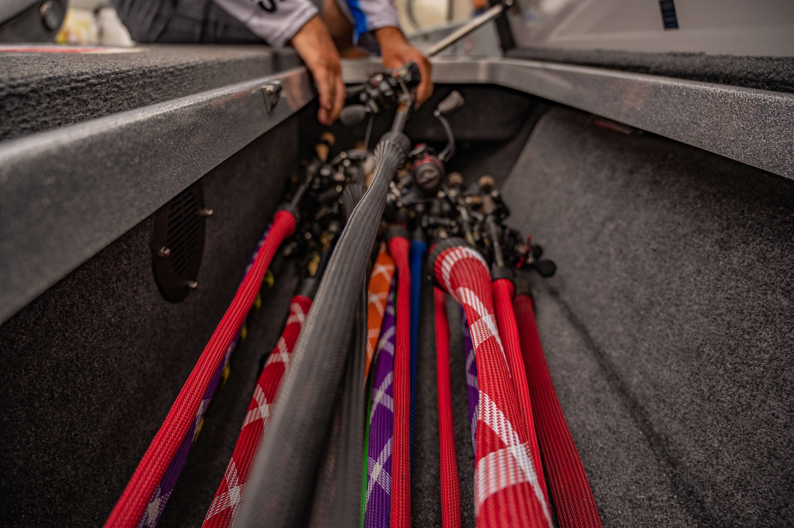 Others were tucked away in the boat for the official practice period. Gleason carefully grabs a few from the front locker of his Phoenix boat.