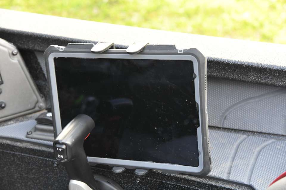 An Apple iPad and holder are rigged near the console for easy viewing. 