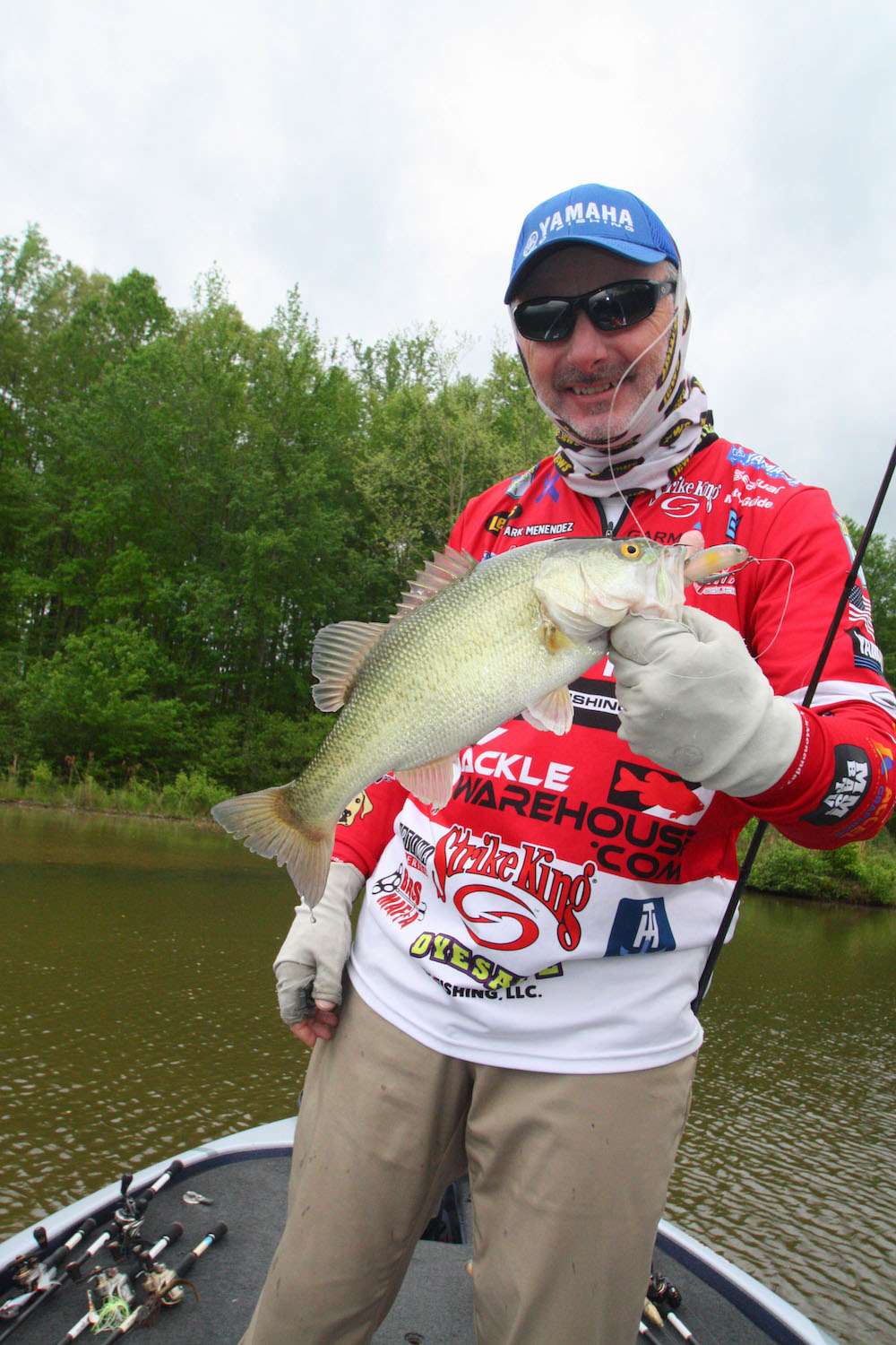 <b>11:02 a.m.</b> Menendez bags a Â­2-7 off a nearby mud flat on the swimbait. <br>
<b>11:04 a.m.</b> He catches a Â­10-inch bass on the trick worm. âThatâs the first nonkeeper Iâve caught all day.â <br>
<b>11:16 a.m.</b> Menendezâs 20th keeper, a Â­2-5 largemouth, eats his floating worm near a stickup. <br>
<b>11:22 a.m.</b> Menendez moves into a C-shaped pocket and spots bluegill beds near the bank. âBluegill spawn a little later than bass. The water here is a couple degrees warmer than uplake, so there may not be as many bedding bass.â
<br><br>
<b>2 HOURS LEFT</B><BR>
<b>11:30 a.m.</b> Light rain is falling as a good fish swirls on Menendezâs floating worm, then swims away. He pulls out a spinning rod and rigs another Perfect Plastic worm, this one in the oxblood pattern, wacky style (hook through the middle) and casts it to the swirl. The bass, a Â­3-pounder, is circling the area. âThatâs a male trying to herd its fry.â <br>
<b>11:47 a.m.</b> No luck with the fry herder, so Menendez continues down the bank with the floating worm. Another Â­3-pounder darts at the worm, then disappears. Menendez immediately tries the Shadalicious but hauls water. <br>
<b>11:52 a.m.</b> Menendez tries a shad-color surface popper near a laydown tree. <br>
<b>11:59 a.m.</b> He casts the trick worm to a boathouse. No takers here. <br>
<b>12:17 p.m.</b> Menendez rockets back uplake to the flat he fished earlier. âI saw more beds up here, and the water is clearer. The temperature has dropped with this incoming front; that could slow things down.â <br>
<b>12:23 p.m.</b> Menendez runs the Shadalicious past the bed where he foul-hooked the Â­6-pounder. <br>
<b>12:26 p.m.</b> Menendez repositions his boat to get a better view of the bed. âHoly crap, there are three fish on that bed, all 2- to 3-pounders. I donât see the Â­6-pounder, though.â He pitches the twin-tail grub repeatedly to the nest. âThereâs a low branch sticking straight over the nest; Iâm having to wedge the lure under it to hit the bed. Iâve been known to snip off limbs with hedge clippers that were in my way when sight fishing in tournaments.â
