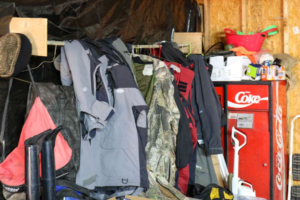The other corner of the man cave is full of rainsuits as well as some hunting clothes. 