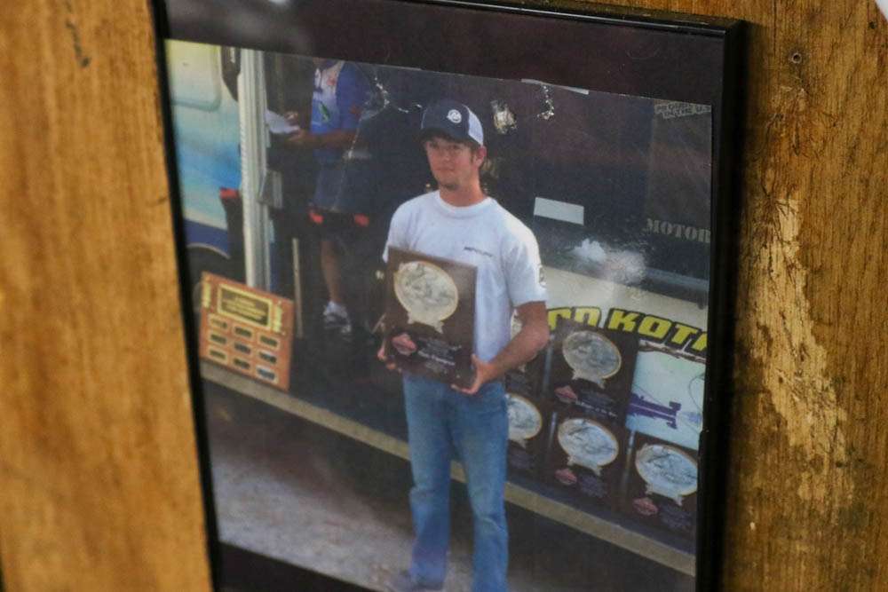 A picture from one of Logan's earliest tournament wins hangs on the wall. Logan was 17 years old in this photo. 