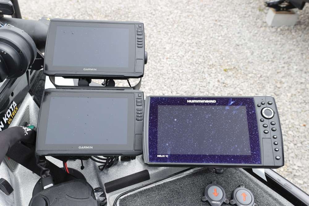 Two Garmin Ecomap Ultra 10 inch units and a Humminbird Helix 10 are mounted with BoatLogix mounts. 
