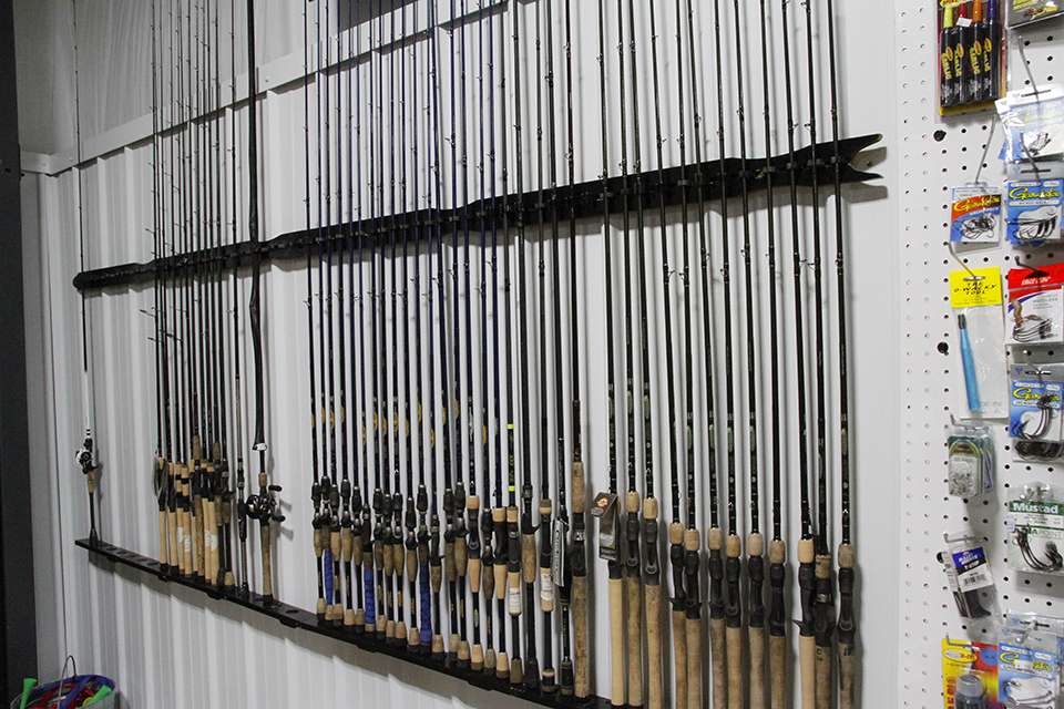 He has an assortment of St. Croix rods stored on the wall of his shop.