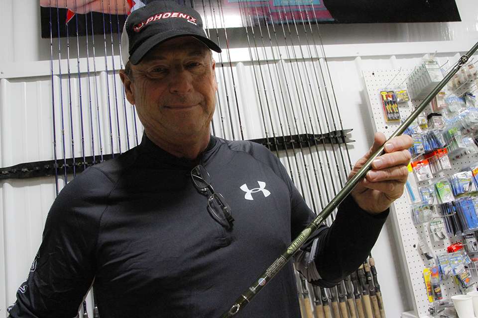Clouse holds up one of his pride and joys. There are always rods that mean something extra special and there are rod models that are an angler's go-to as well.