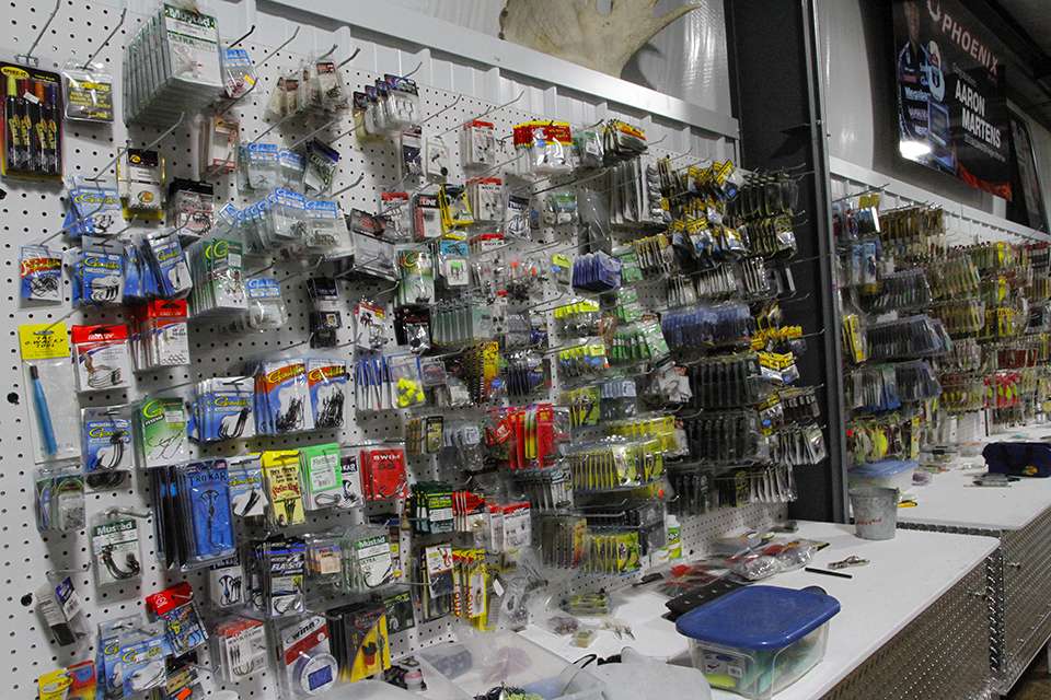 Next to the rods is a giant peg board with an assortment of lures.